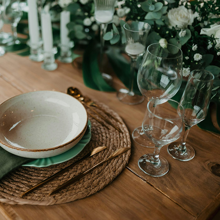 Rustic tablescape with natural greenery centerpieces and candles